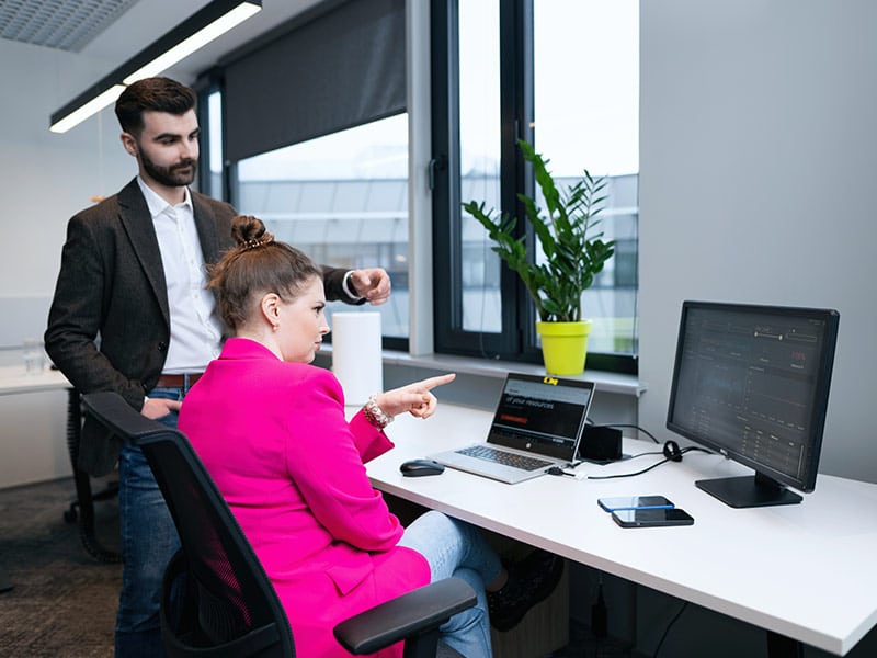 Two Mainlink employees discussing about smart metering system